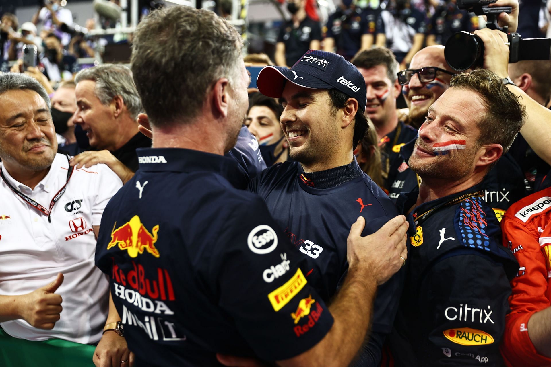 Red Bull boss Christian Horner (left of center) and Sergio Perez (right of center) at the F1 Grand Prix of Abu Dhabi