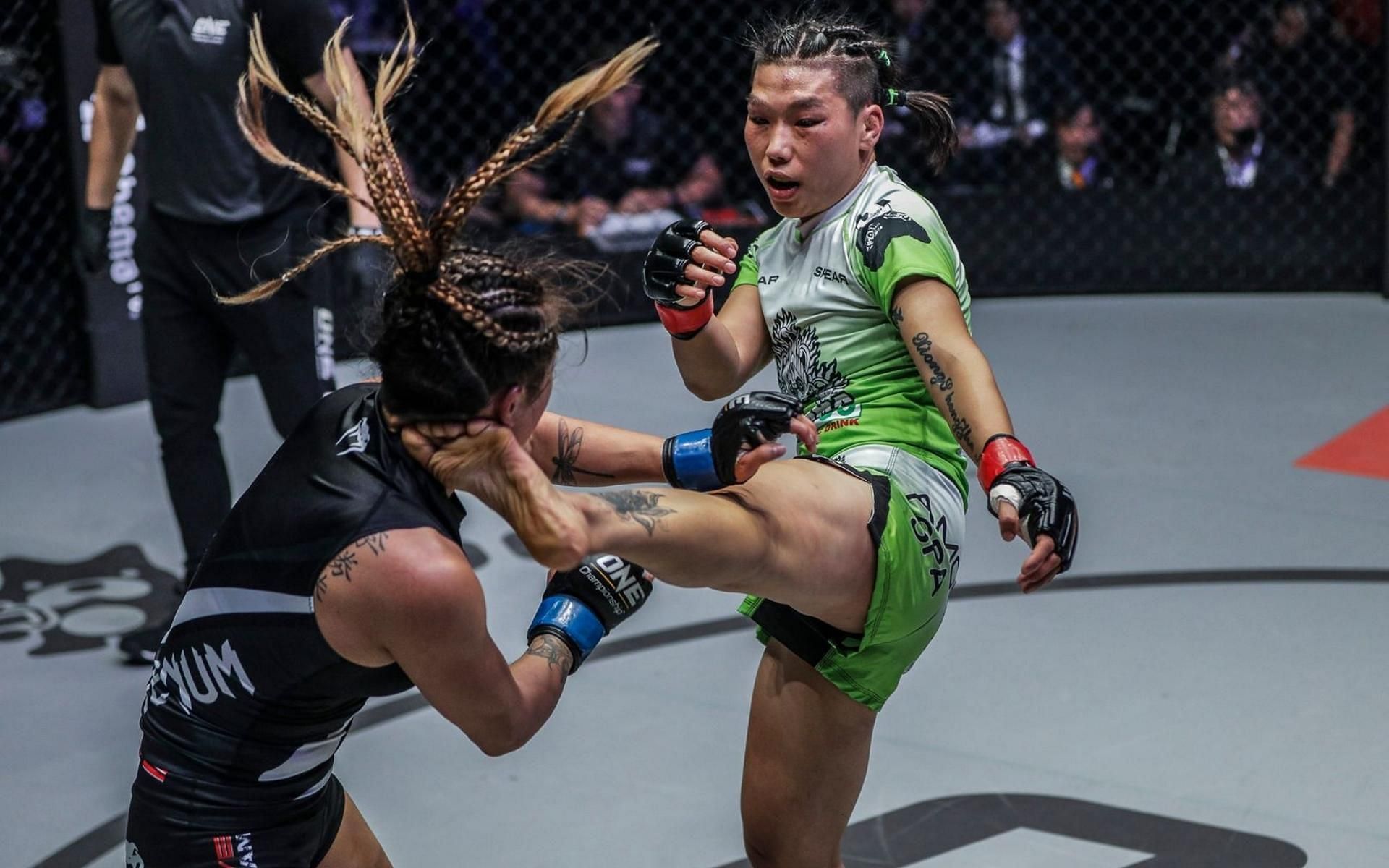 ONE Championship strawweight world champion Xiong Jing Nan (right) will defend her title in the main event of ONE: Heavy Hitters. (Image courtesy of ONE Championship)