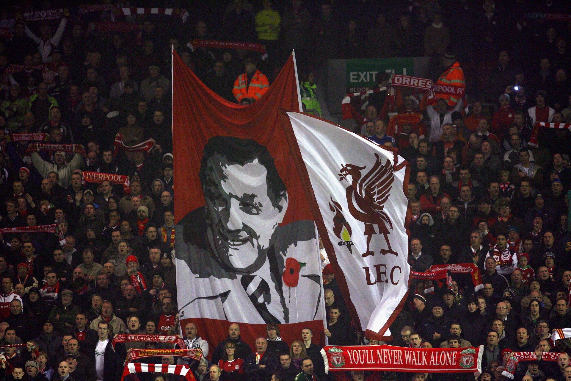 Liverpool fans raise a banner of legendary coach Bob Paisley.
