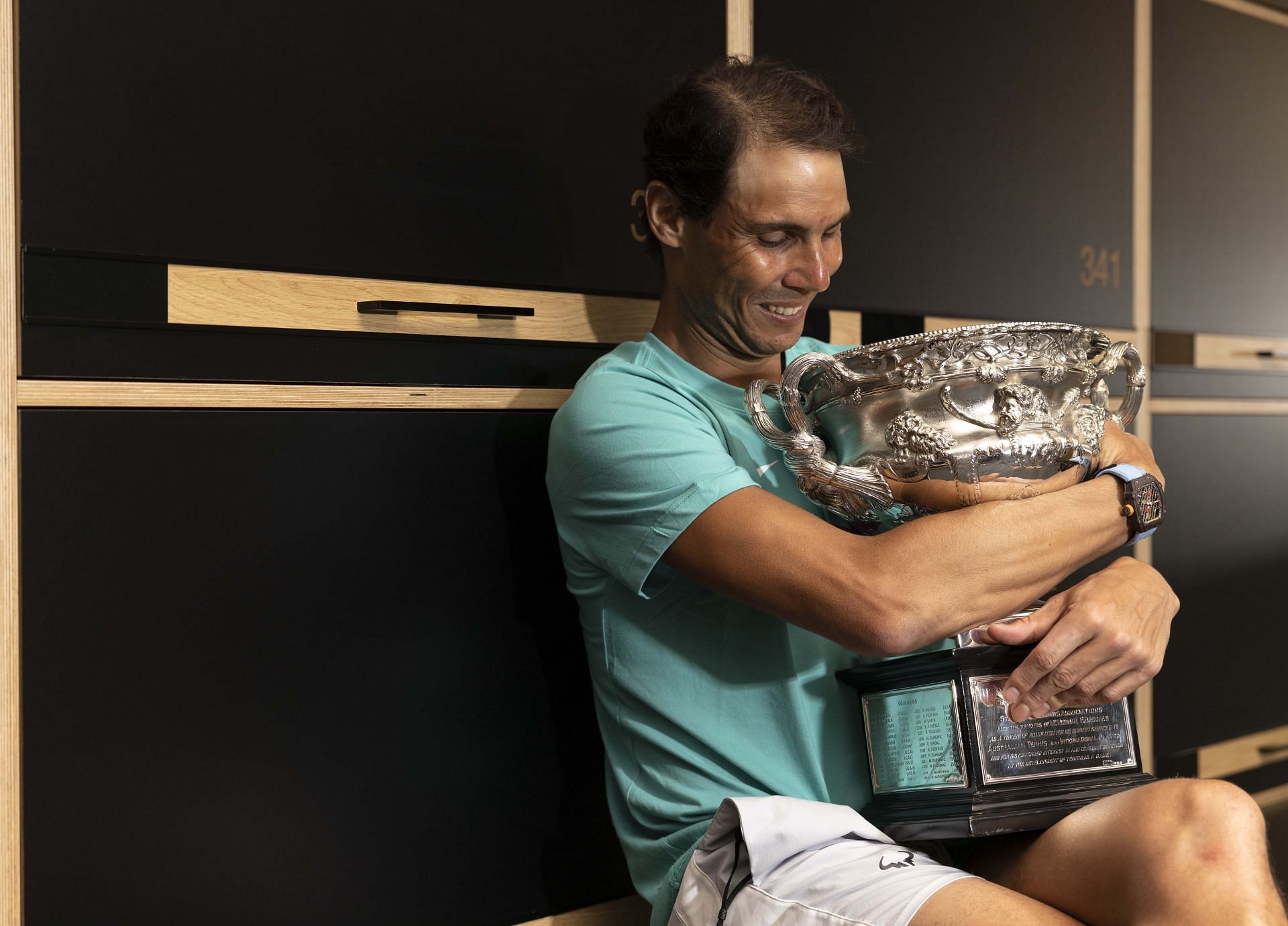 Rafael Nadal poses with the Australian Open men&#039;s singles final trophy