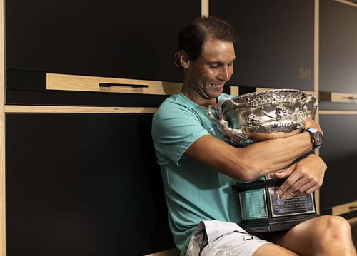 Rafael Nadal poses with the Australian Open men's singles final trophy