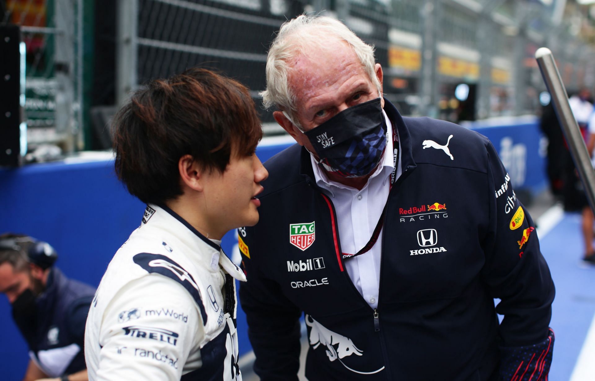 Yuki Tsunoda (left) and Helmut Marko (right) ahead of the 2021 Russian Grand Prix
