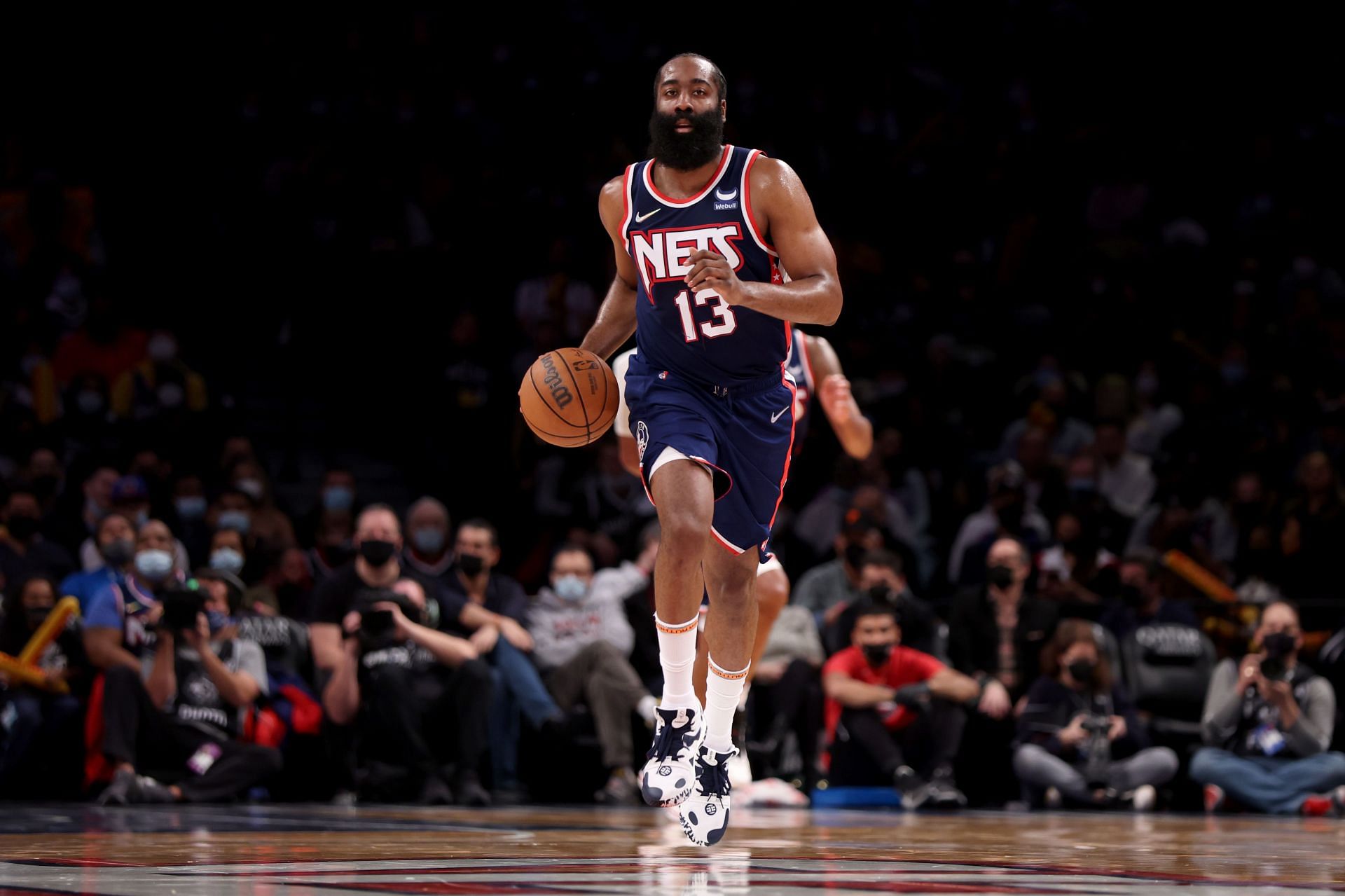 James Harden scans the floor to make a play for the Brooklyn Nets.