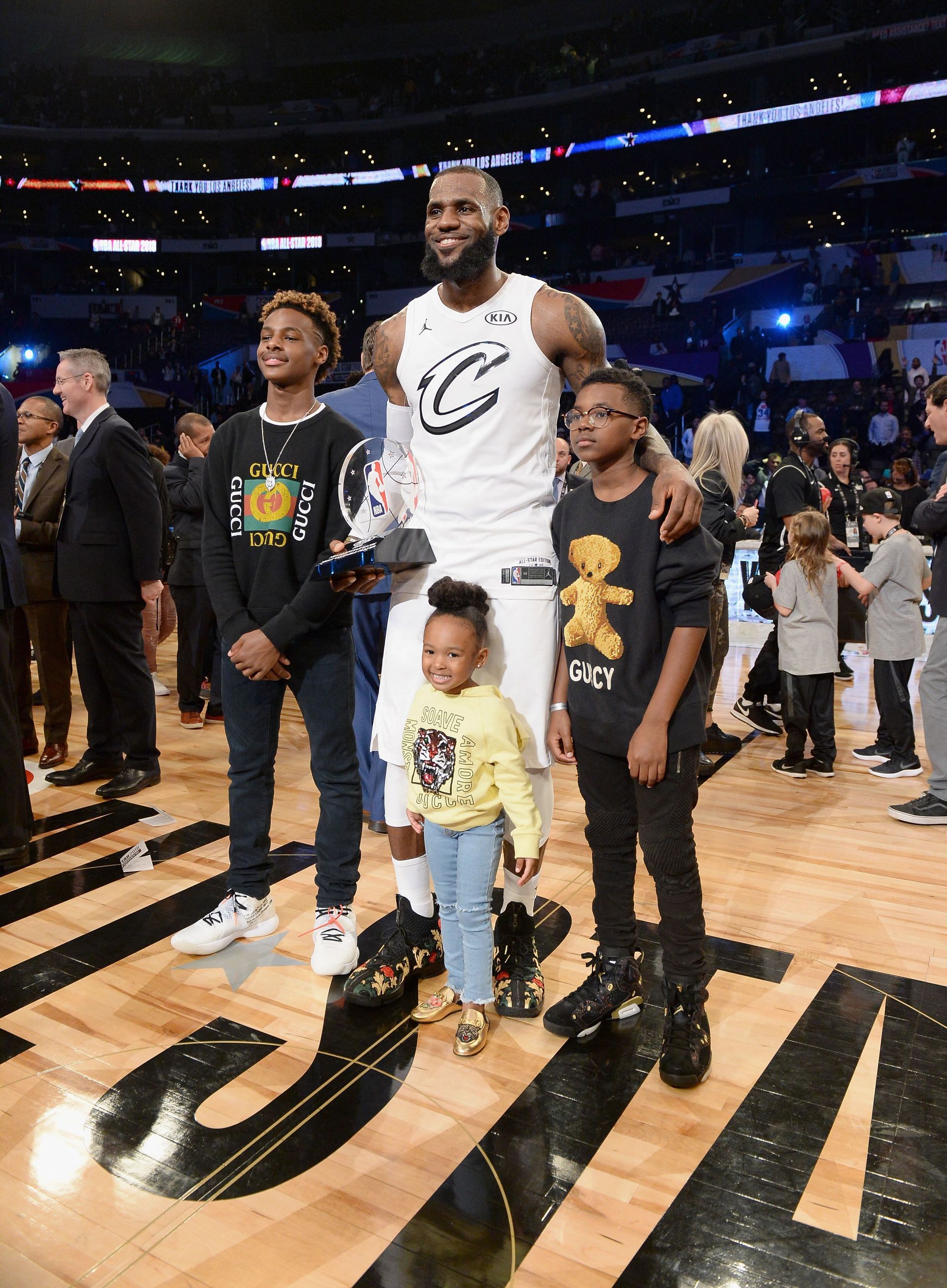 LeBron James Jr., LeBron James (23), Zhuri James and Bryce Maximus James pose with the All-Star Game MVP trophy on Feb. 18, 2018 in Los Angeles, California.
