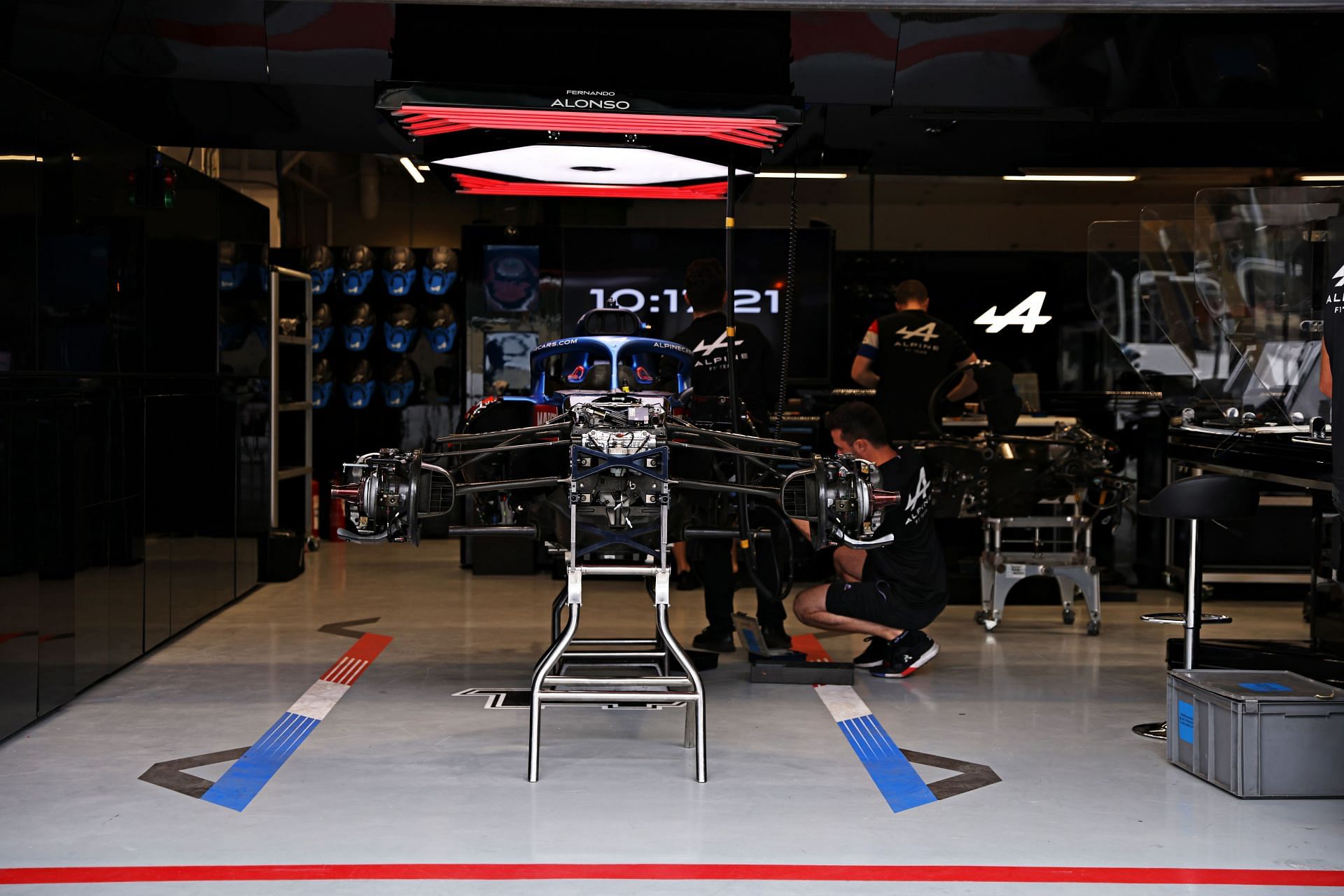 The Alpine F1 Team works in the garage ahead of an F1 race (Photo by Buda Mendes/Getty Images)
