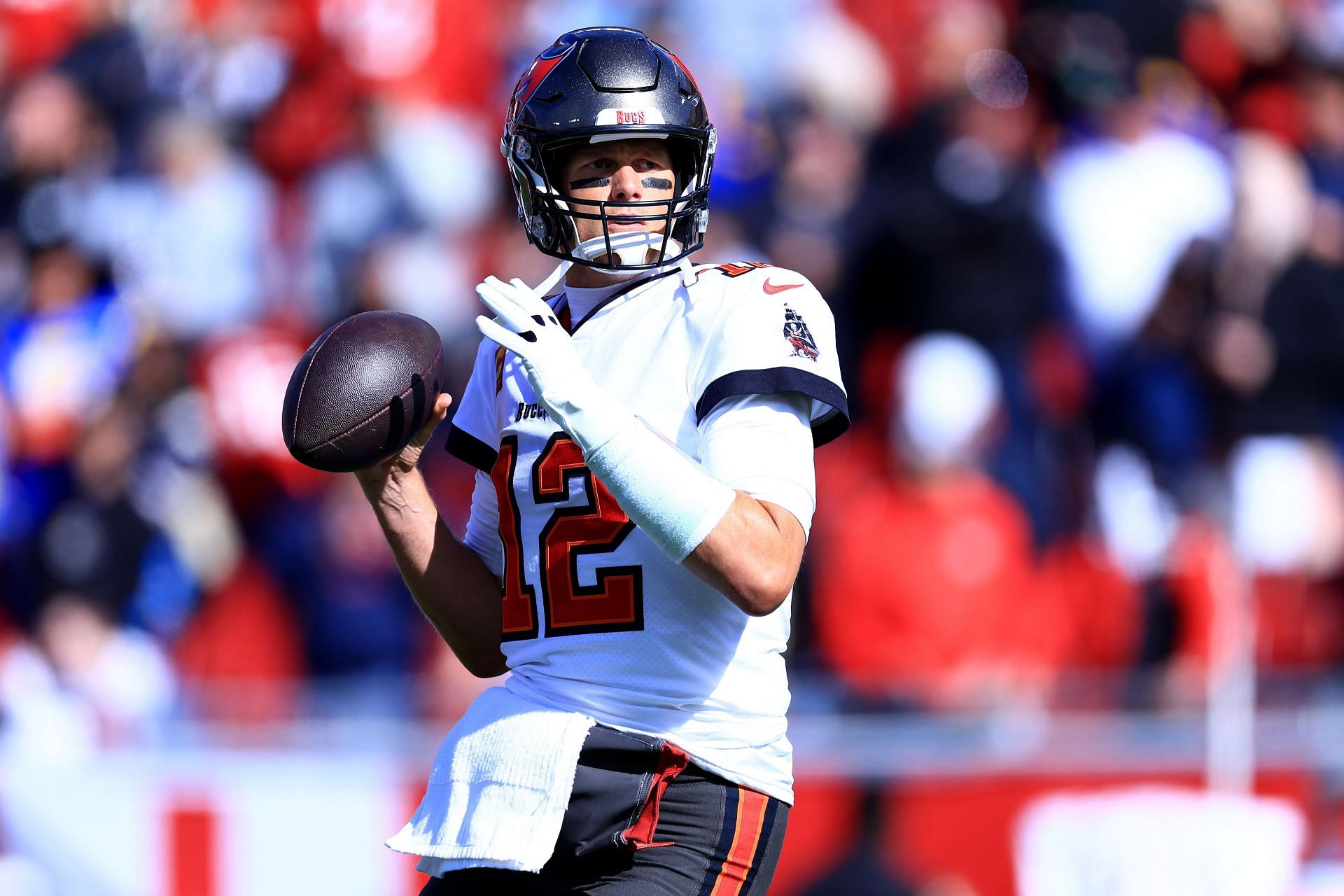 Tom Brady #12 of the Tampa Bay Buccaneers warms up prior to playing the Los Angeles Rams in the NFC Divisional Playoff game at Raymond James Stadium on January 23, 2022 in Tampa, Florida.