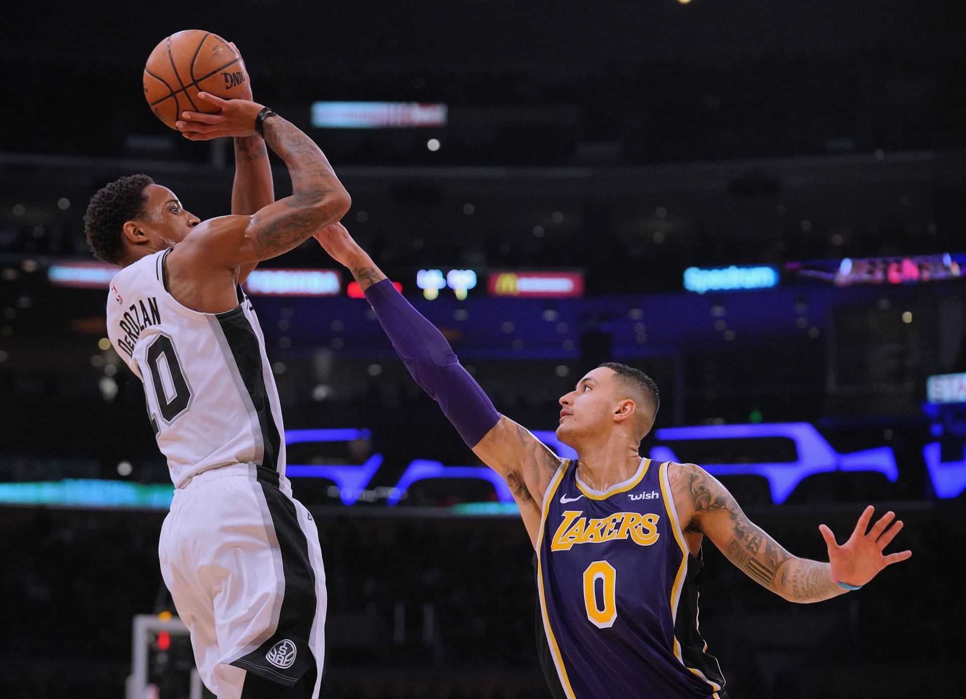 DeMar DeRozan #10 of the San Antonio Spurs scores on a jumper over Kyle Kuzma #0 of the Los Angeles Lakers during a 121-113 Laker win at Staples Center on December 5, 2018 in Los Angeles, California. iNew York Knicks v Chicago Bulls