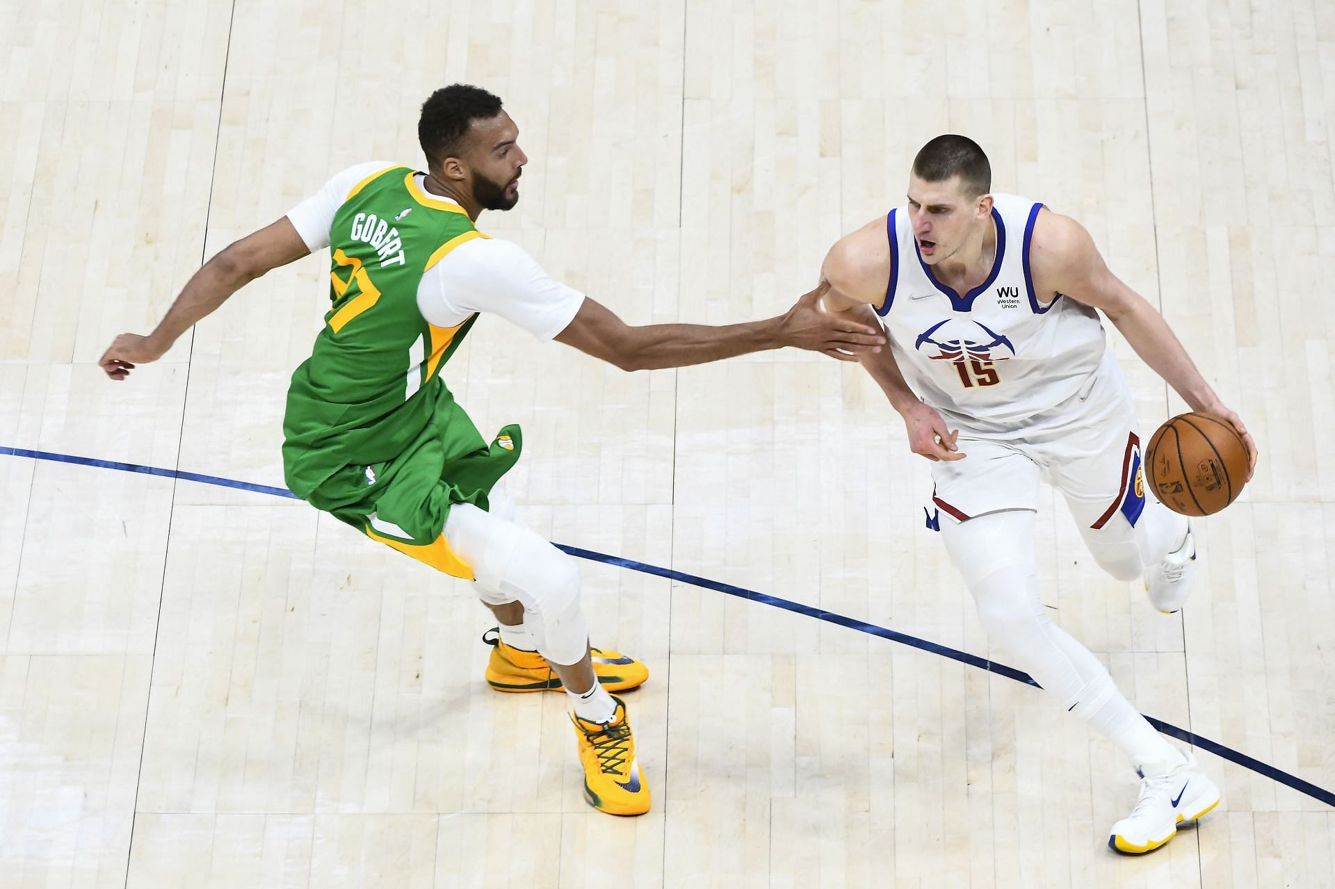 Nikola Jokic of the Denver Nuggets against Utah Jazz&#039;s Rudy Gobert