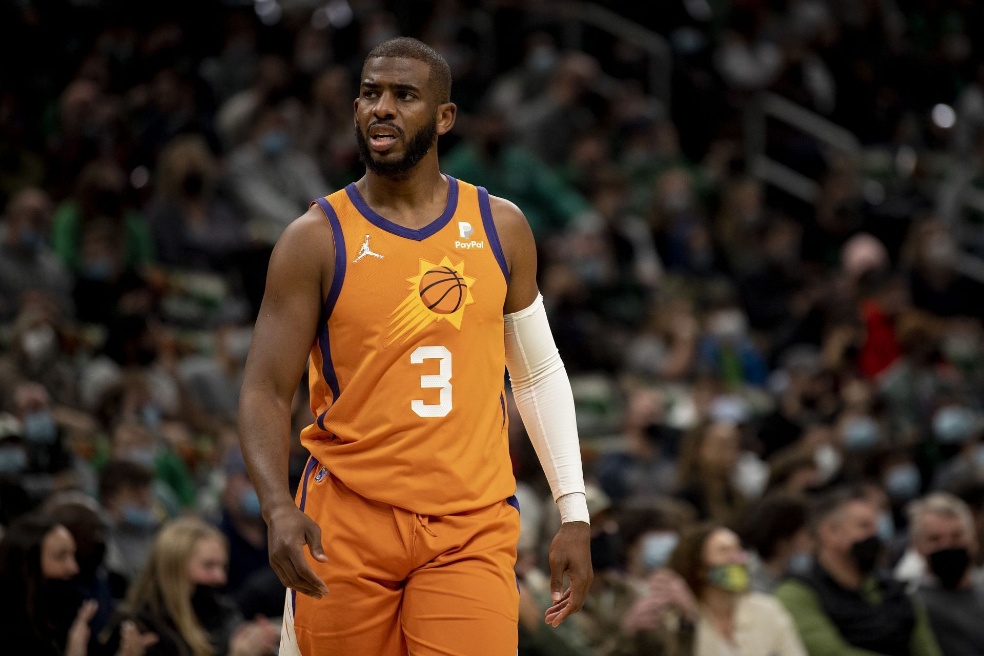 Chris Paul #3 of the Phoenix Suns looks on during the first half of a game against the Boston Celtics at TD Garden on December 31, 2021 in Boston, Massachusetts.