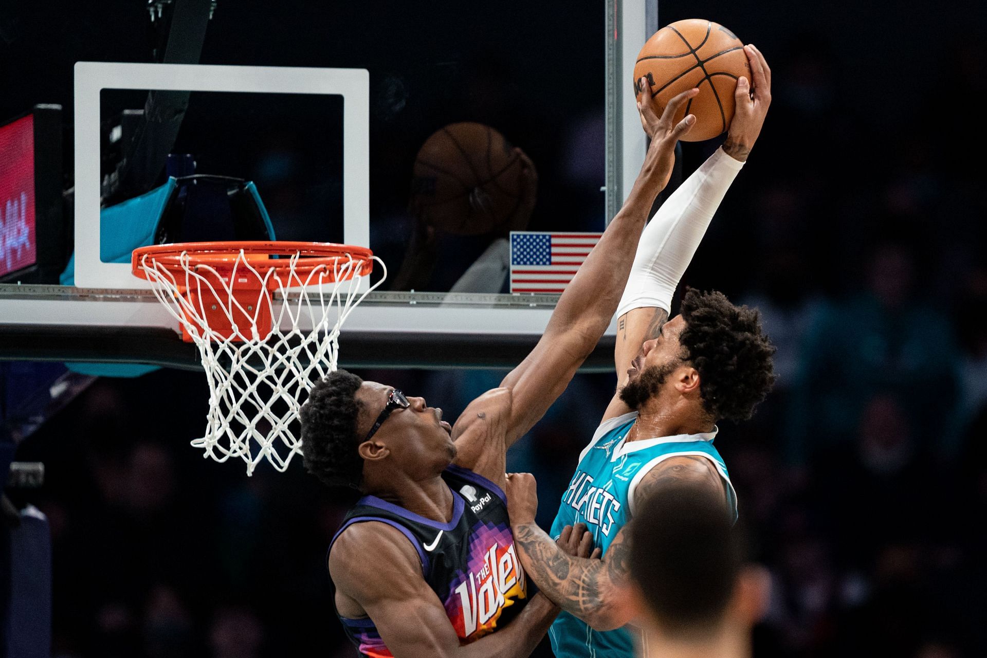 Jalen Smith attempts to block a Miles Bridges dunk attempt.