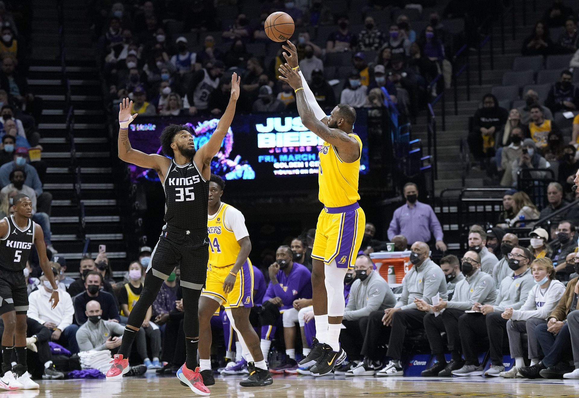 LeBron James #6 of the Los Angeles Lakers shoots a three-point shot over Marvin Bagley III #35 of the Sacramento Kings