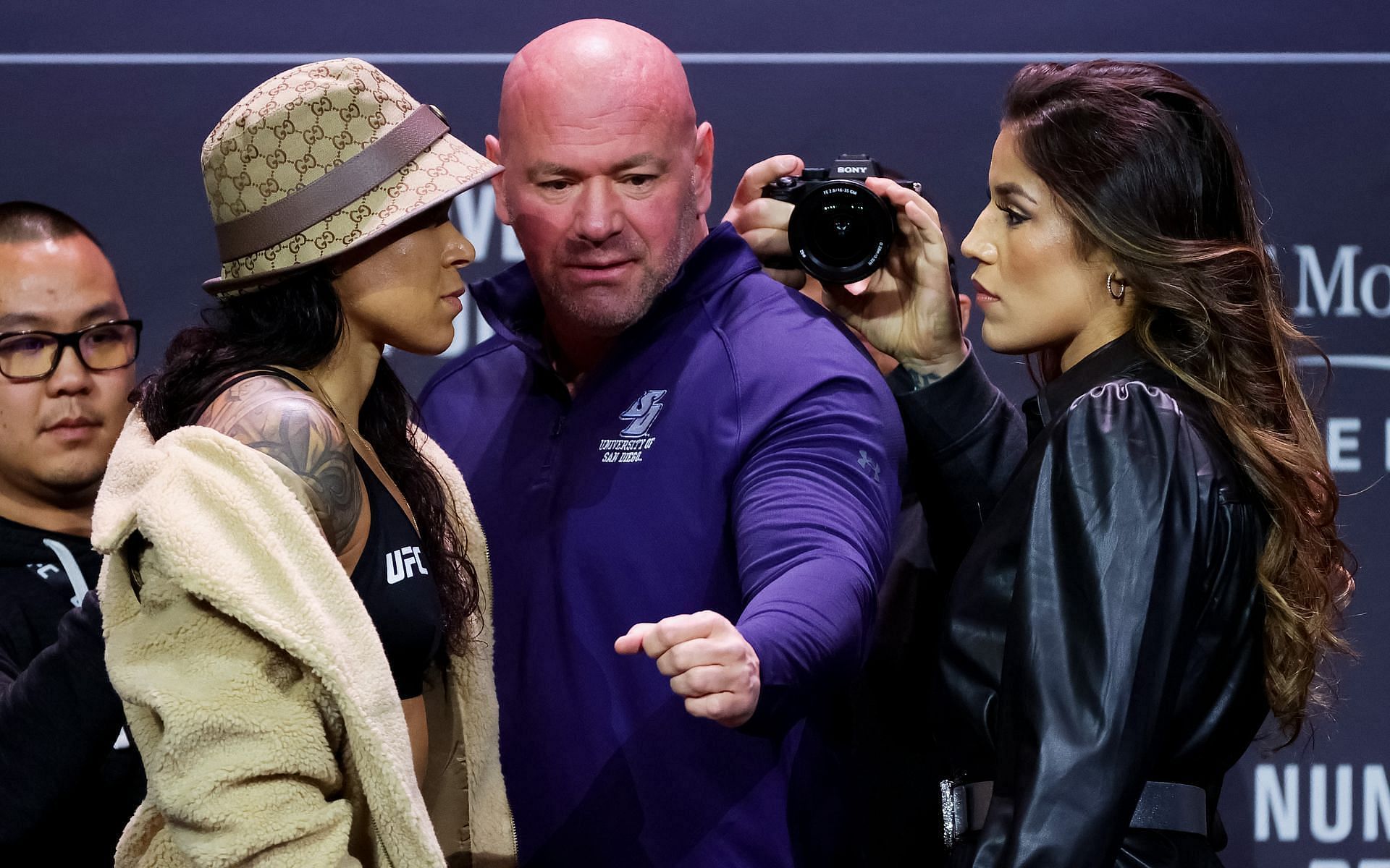 Dana White (center) with UFC women&#039;s bantamweight adversaries Amanda Nunes (left) and Julianna Pena (right) at the UFC 269 face off