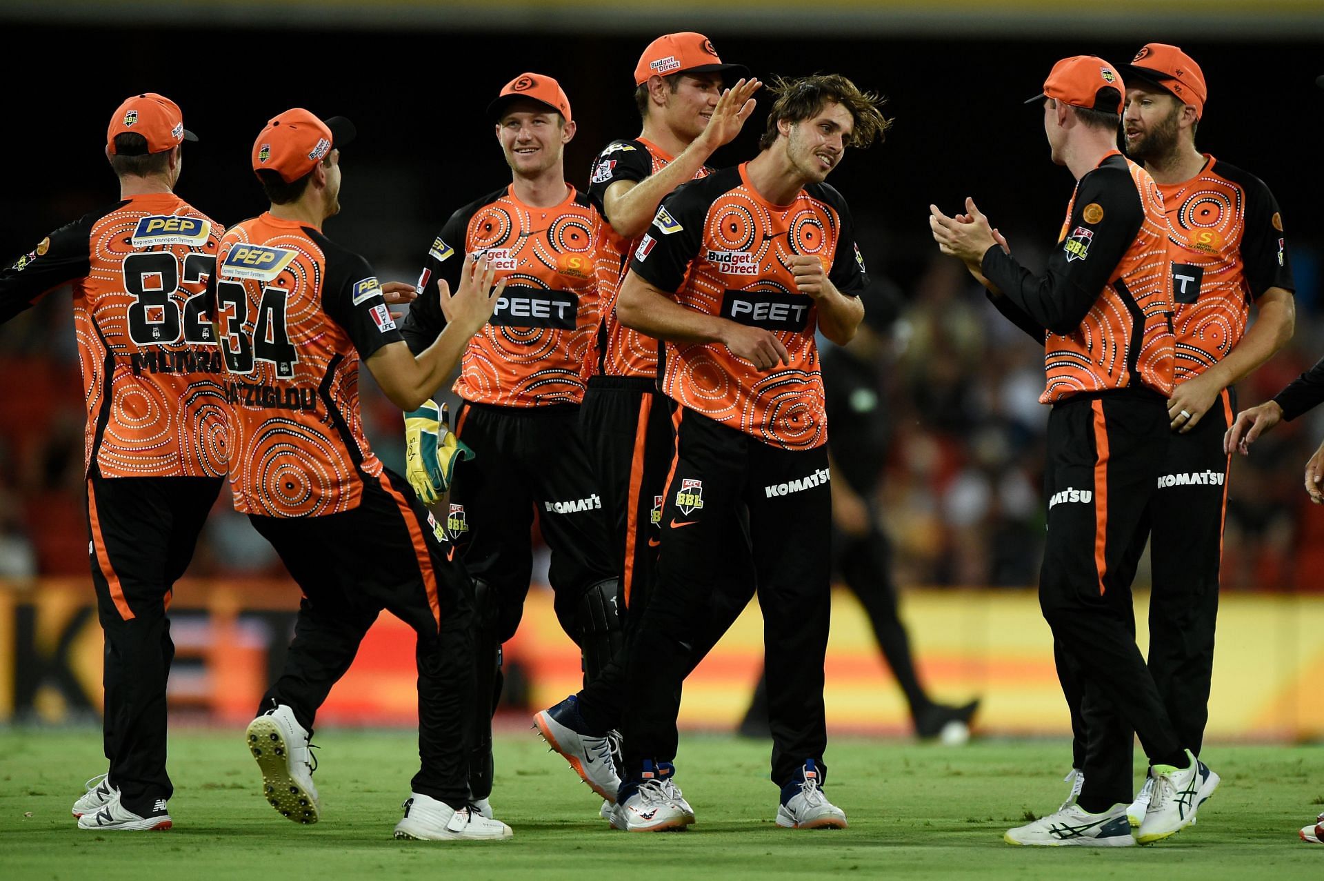 The Scorchers celebrating the fall of a wicket.