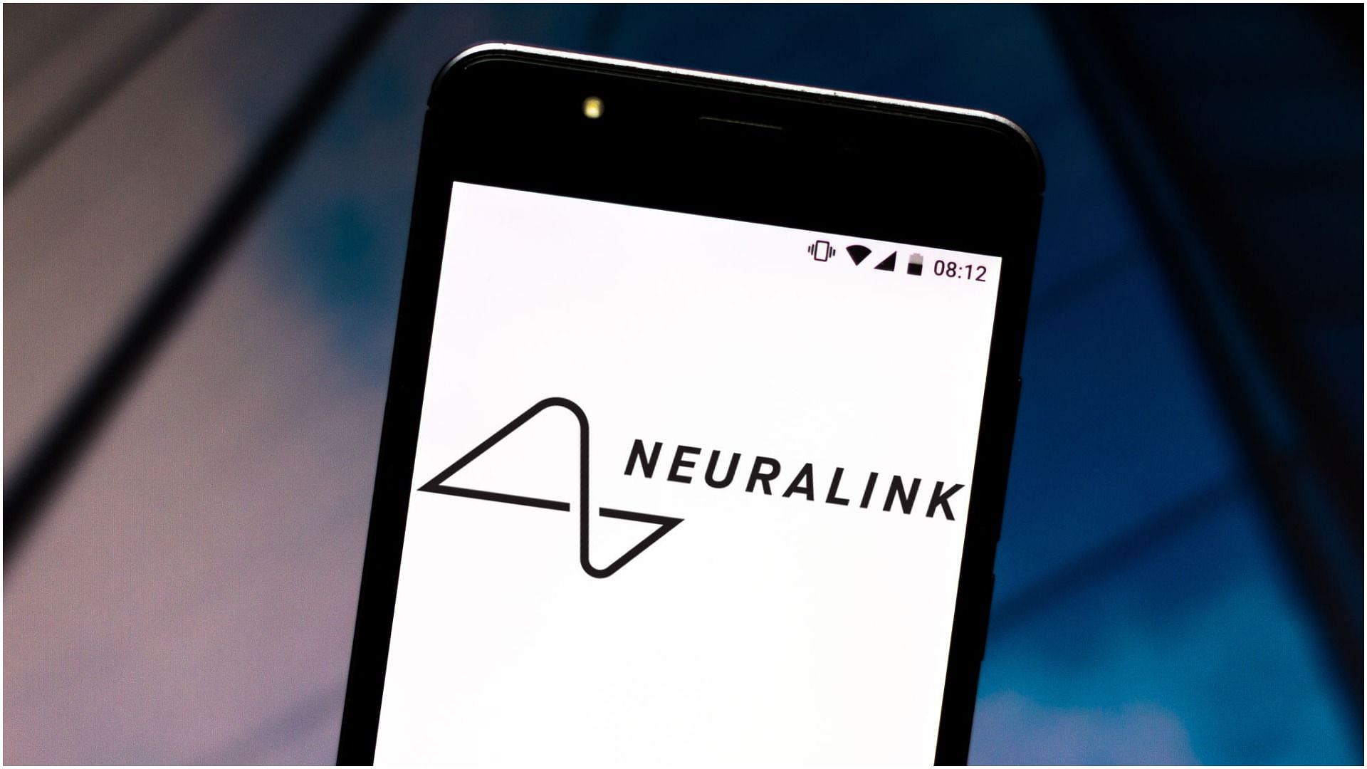 Neuralink logo displayed on a smartphone (Image via Rafael Henrique/Getty Images)