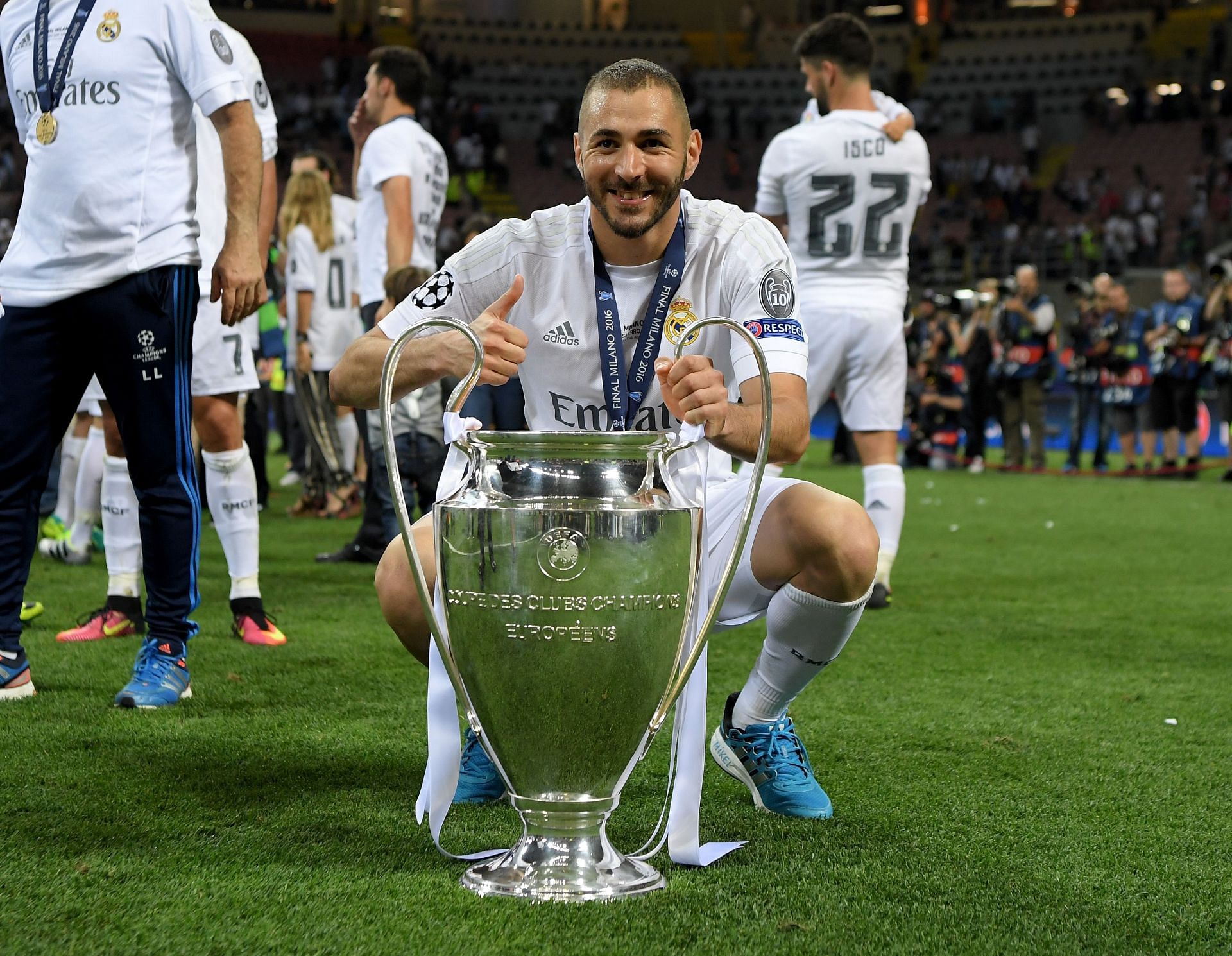 Karim Benzema poses with the UEFA Champions League trophy