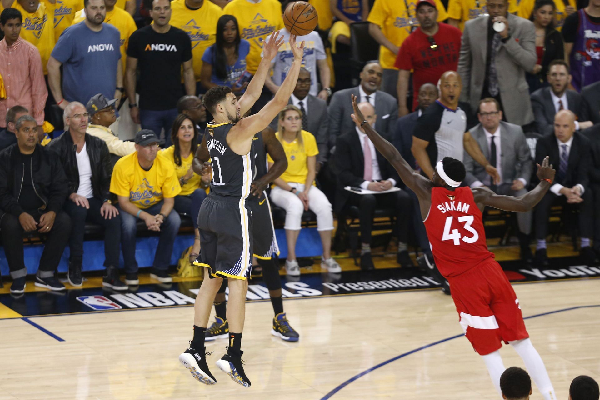 Klay Thompson #11 of the Golden State Warriors attempts a shot against Pascal Siakam #43 of the Toronto Raptors