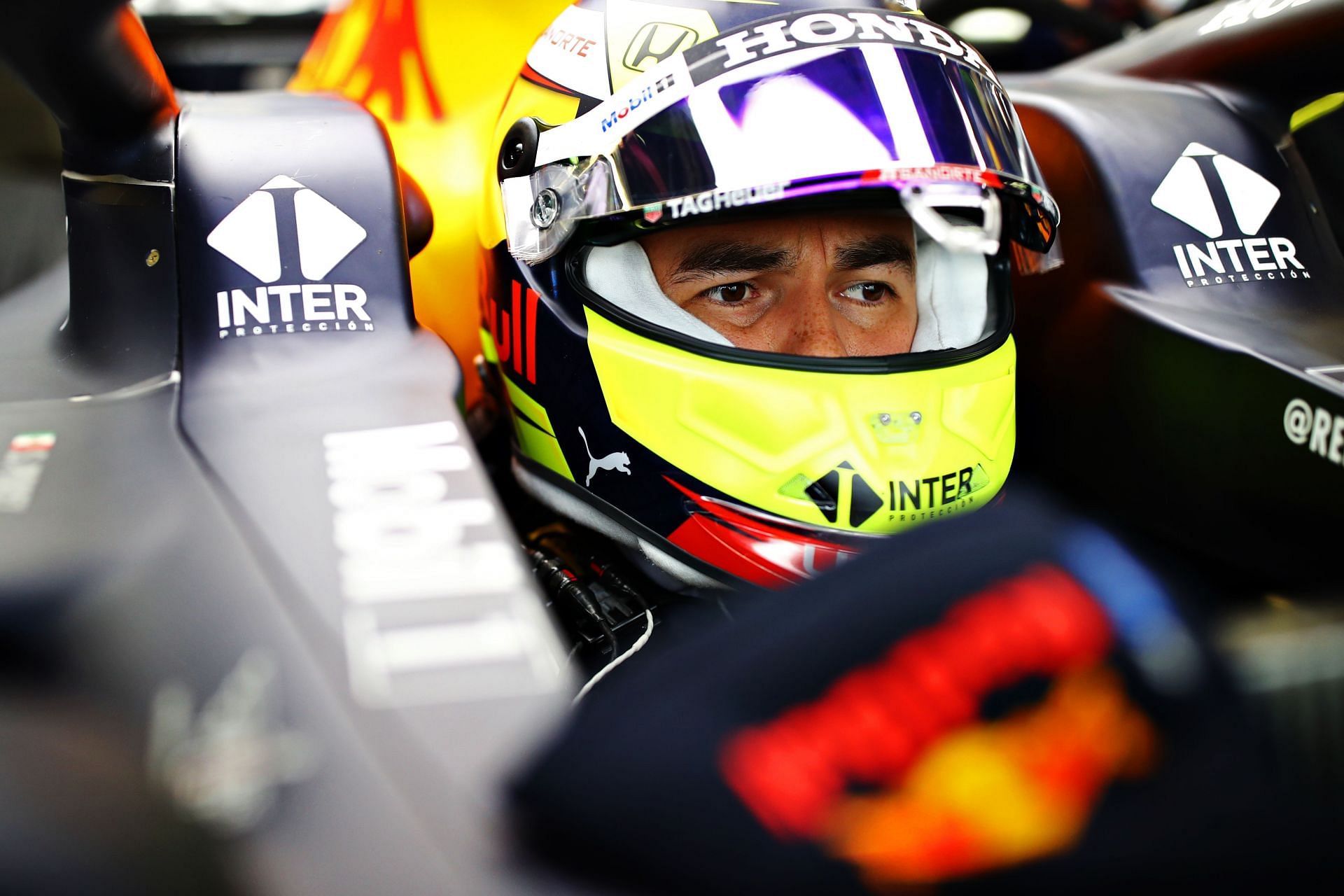 Sergio Perez sampling his Red Bull RB16B for the first time during the team&#039;s pre-season filming day