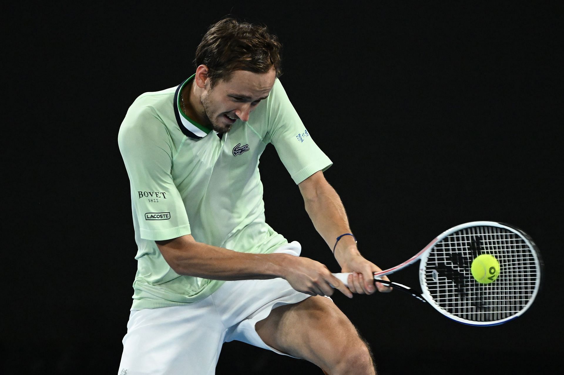 Daniil Medvedev hits a backhand during his 2022 Australian Open semifinal win over Stefanos Tsitsipas