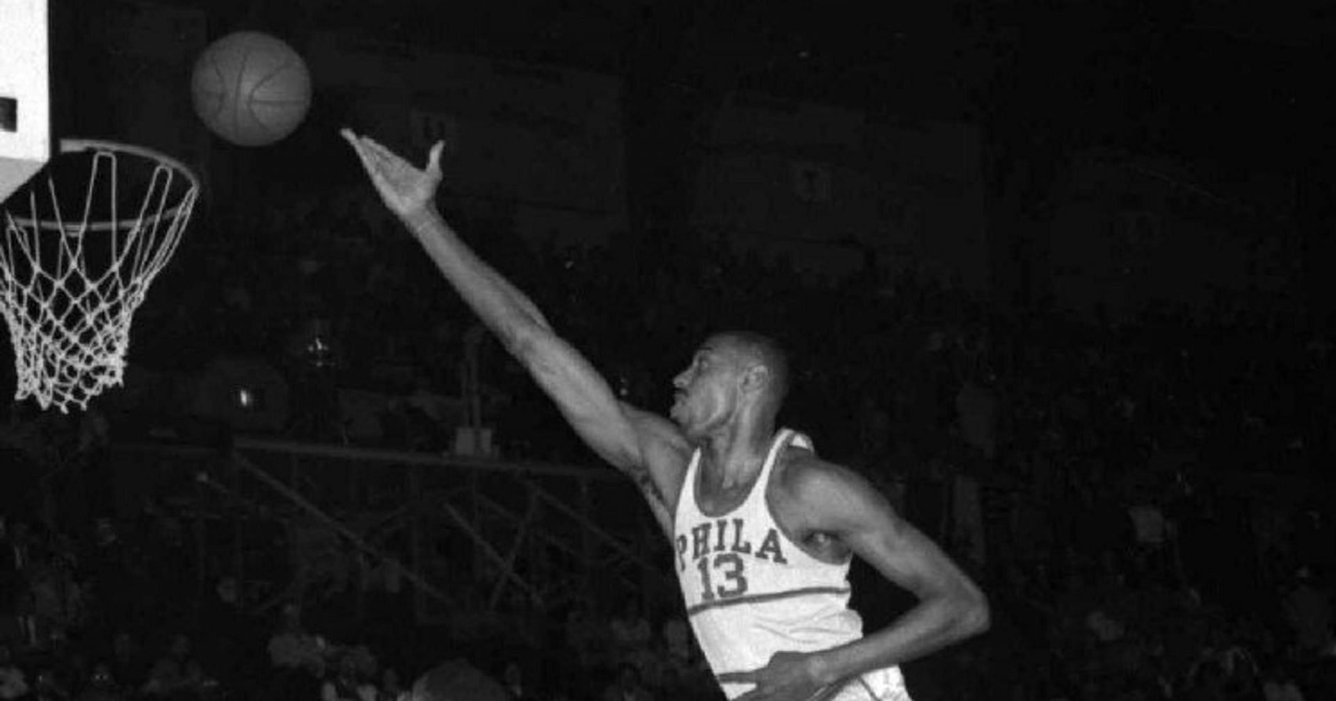 Wilt Chamberlain scoring a basket during his playing days.