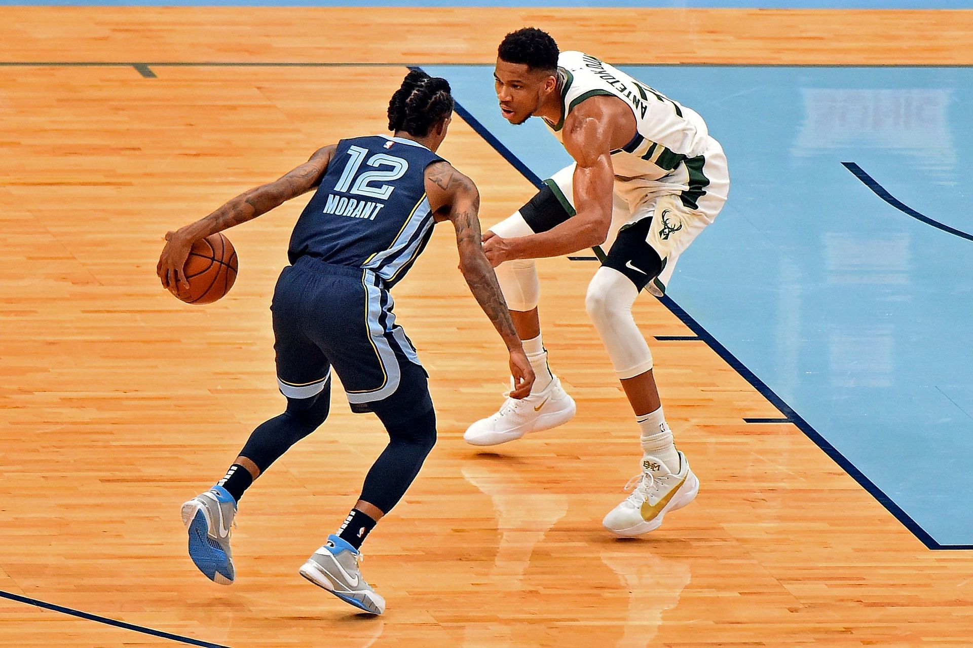 Ja Morant being guarded by Giannis Antetokounmpo
