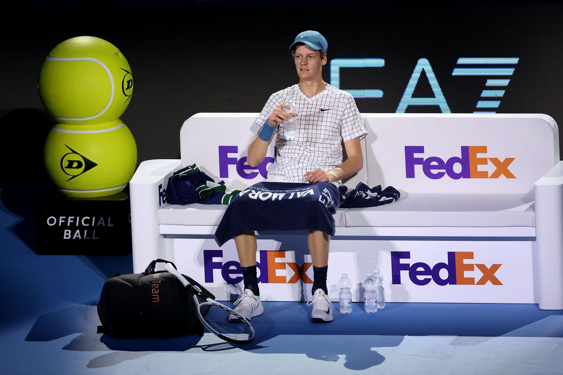 Jannik Sinner sits during a round-robin tie at the 2021 ATP Finals in Turin