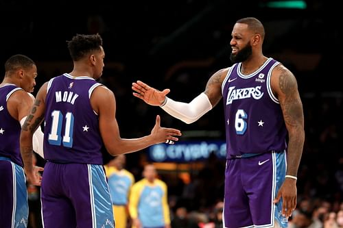 Malik Monk #11 of the Los Angeles Lakers reacts after a play with LeBron James #6