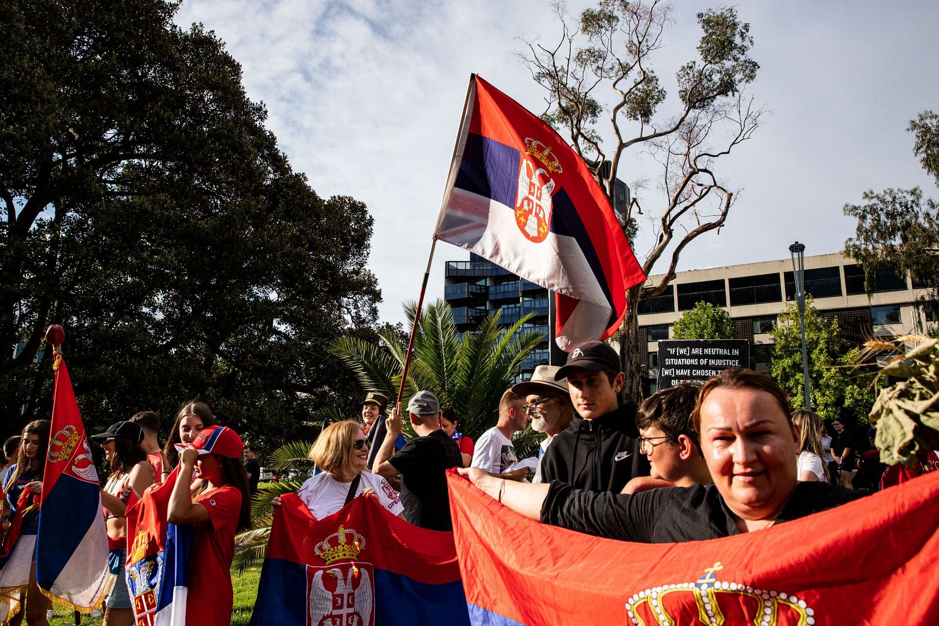 Serbian supporters gather outside a Melbourne hotel in support of Novak Djokovic