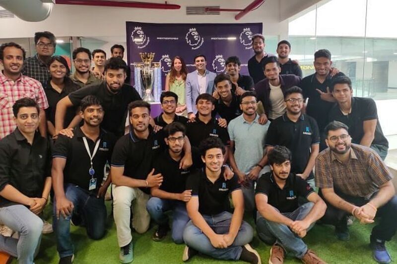 Premier League - Head of International Business, Kate Hodgkinson with the trophy and the students at the GISB Campus