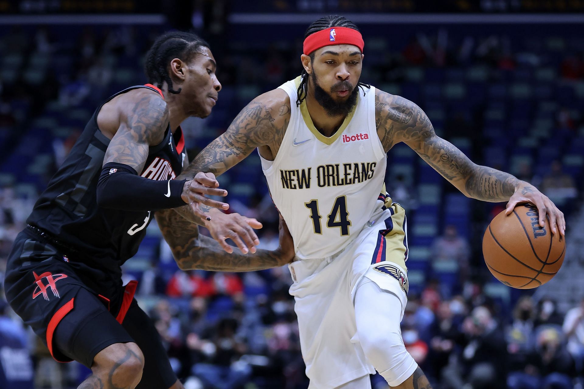 Brandon Ingram attempts to drive past Kevin Porter Jr.