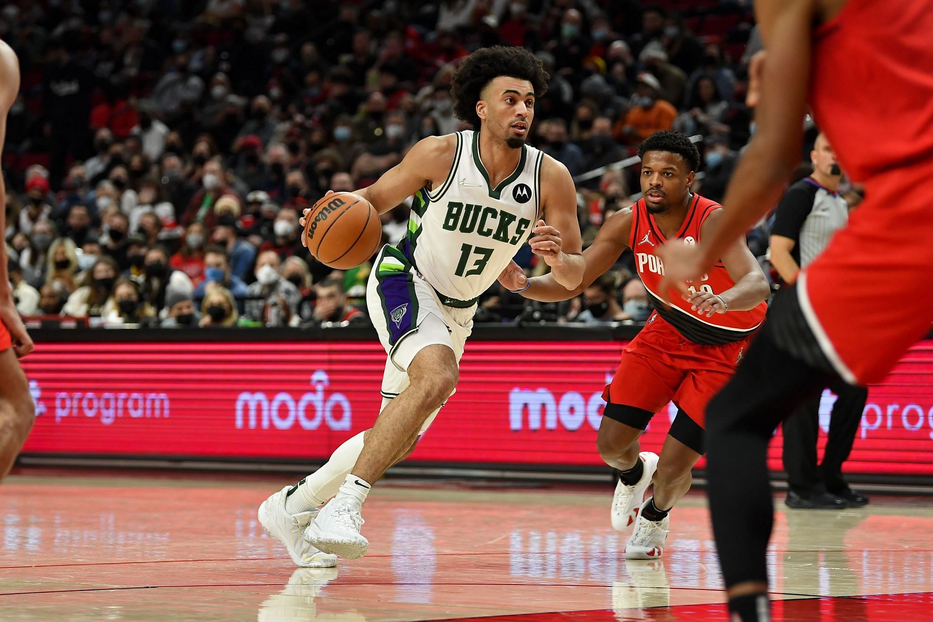 Jordan Nwora #13 of the Bucks drives to the basket during the fourth quarter against the Portland Trail Blazers at the Moda Center on February 05, 2022 in Portland, Oregon. The Milwaukee Bucks won 137-108.