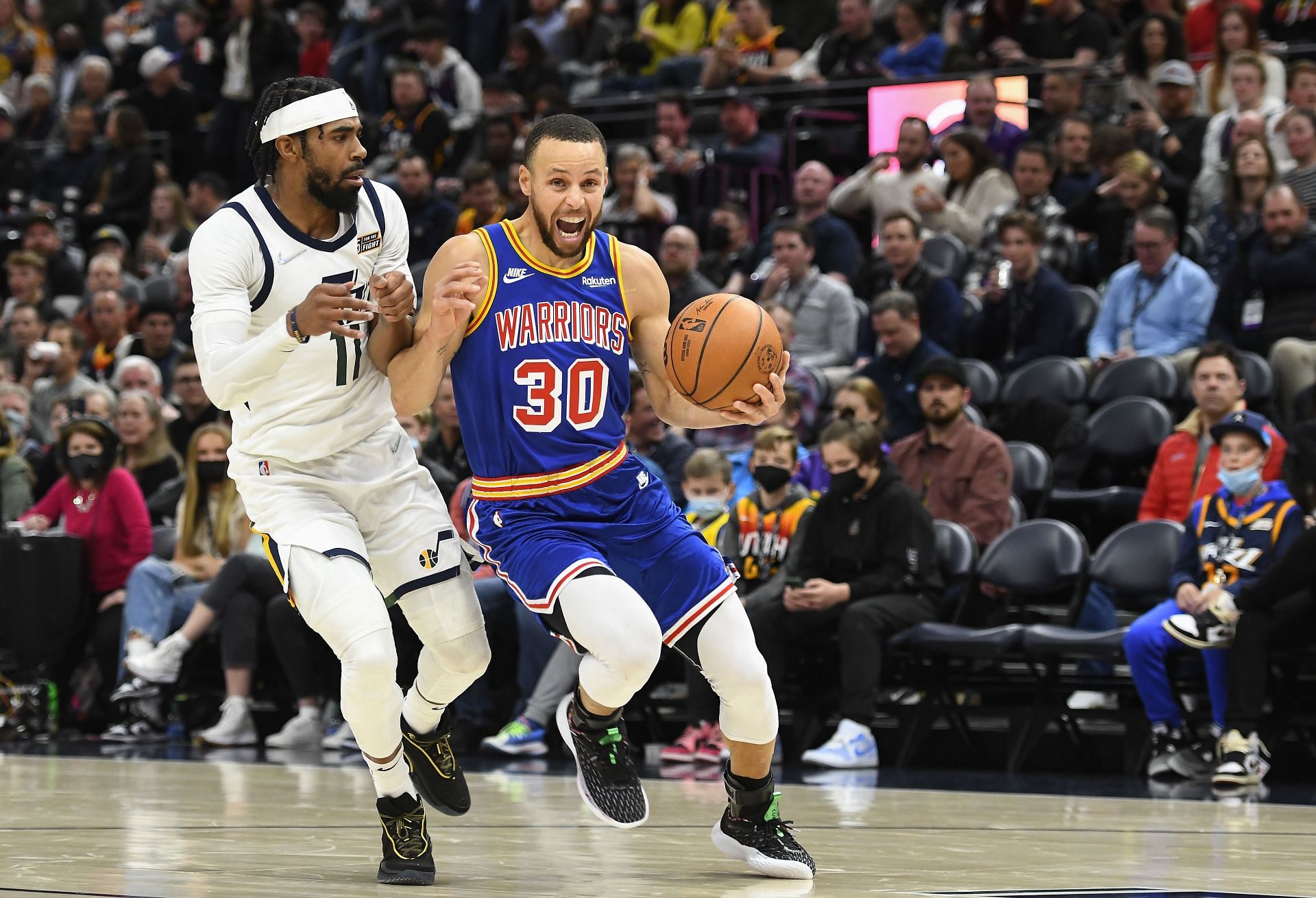 Steph Curry of the Golden State Warriors drives against Mike Conley of the Utah Jazz during the second half at Vivint Smart Home Arena on Feb. 9 in Salt Lake City, Utah.