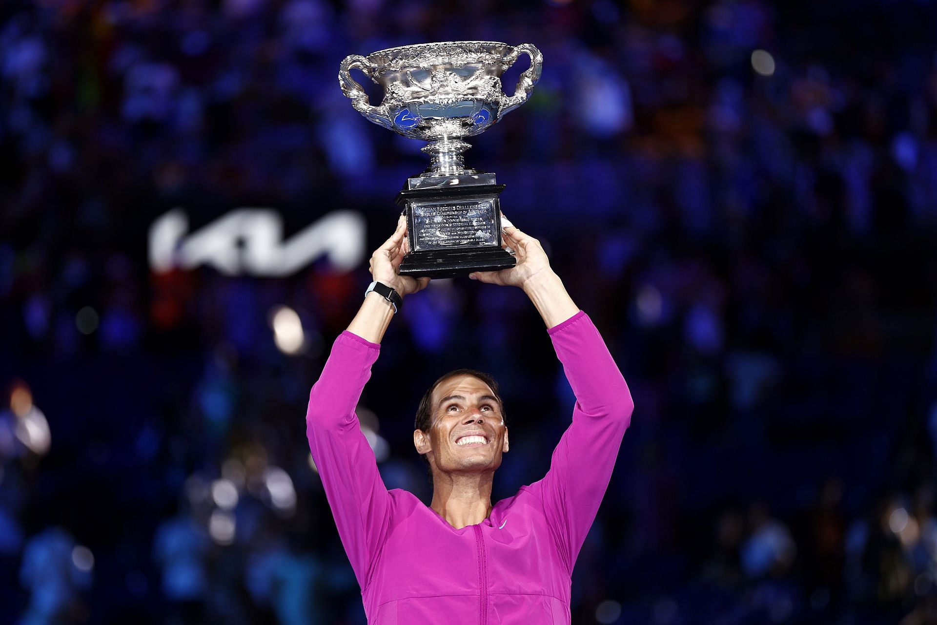 Rafael Nadal lifts the Norman Brookes Challenge Cup after winning the 2022 Australian Open