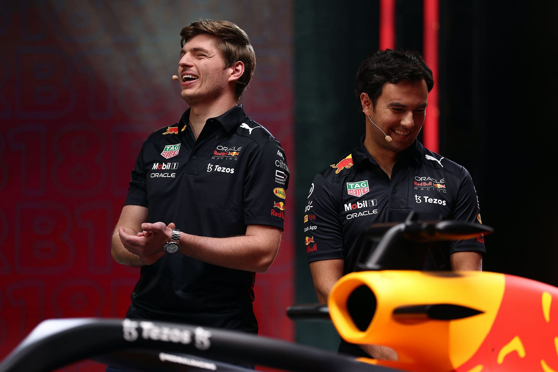 Max Verstappen (left) and Sergio Perez (right) on stage during the Red Bull Racing RB18 launch (Photo by Bryn Lennon/Getty Images)