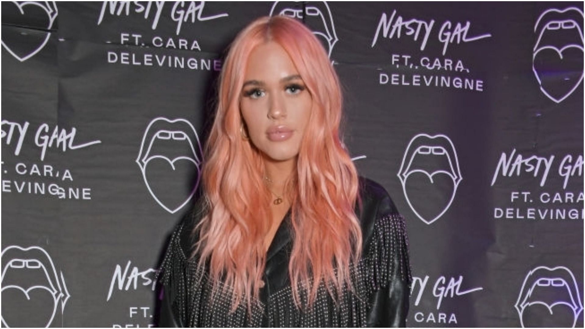 Lottie Tomlinson attends the launch of Nasty Gal Ft. Cara Delevingne (Image via David M. Benett/Getty Images)