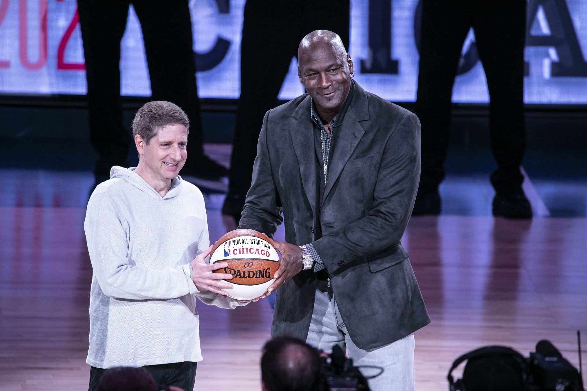 Chicago Bulls President/COO Michael Reinsdorf Jr. (L) accepts the ceremonial All-Star ball from Charlotte Hornets Chairman Michael Jordan at the 68th NBA All-Star Game on February 17, 2019 in Charlotte, North Carolina.