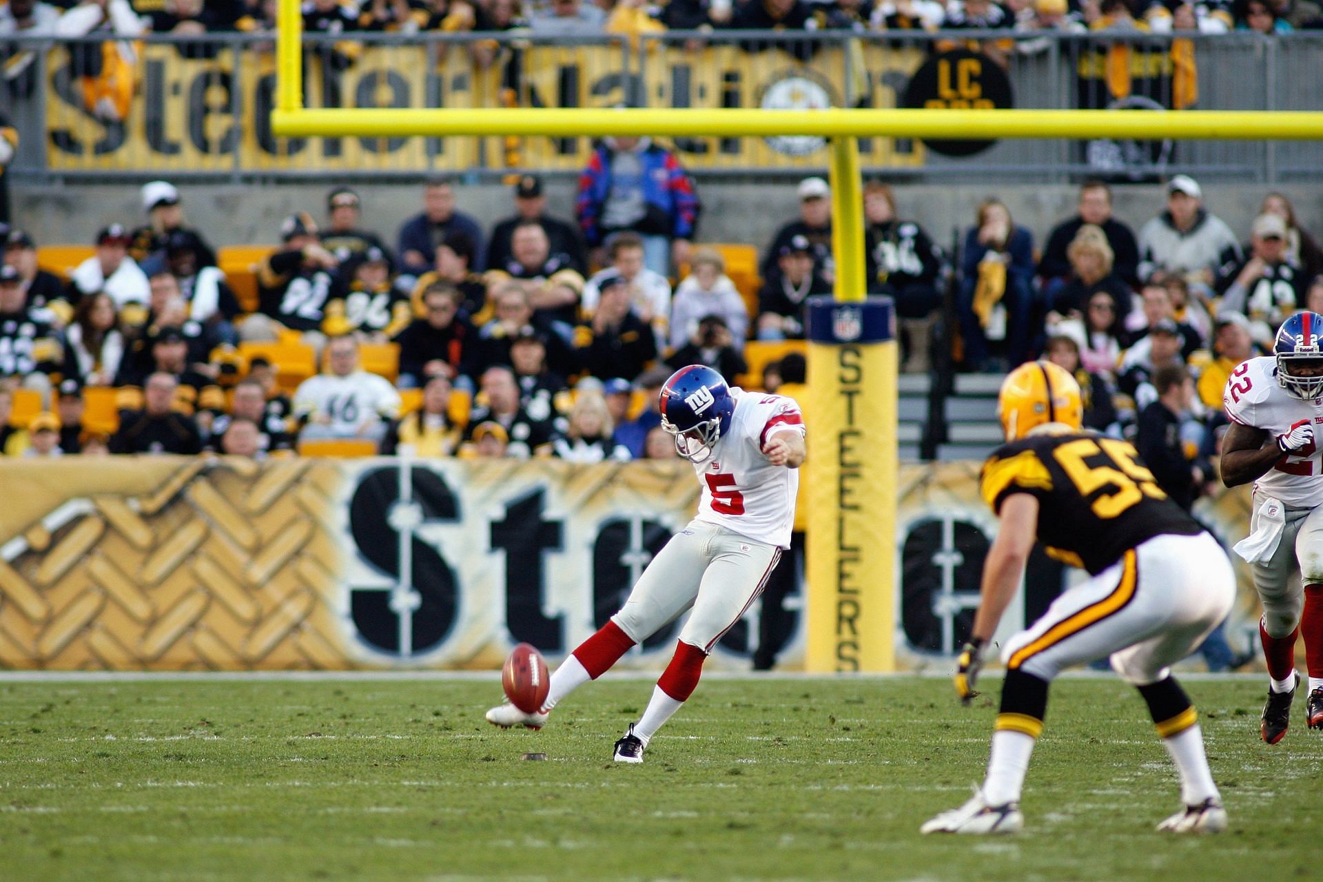 Carney launches a kickoff in 2008 as a member of the New York Giants (Photo: Getty)