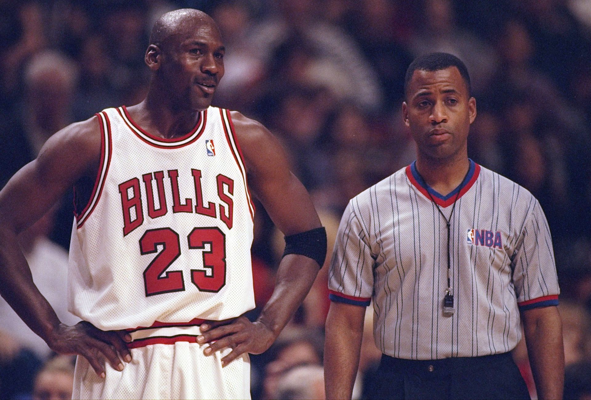 Michael Jordan of the Chicago Bulls confers with an official