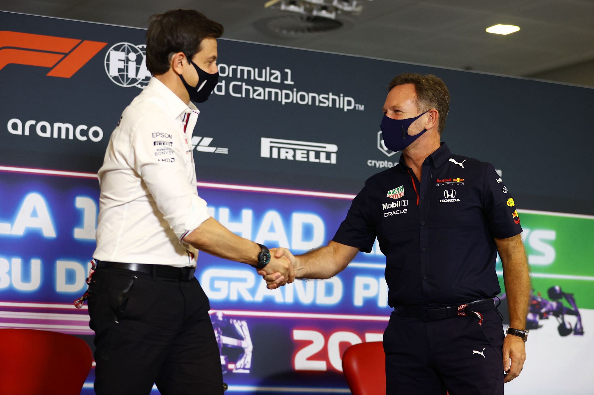 Christian Horner (right) and Toto Wolff share a friendly handshake ahead of the 2021 Qatar Grand Prix