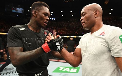 Israel Adesanya (left) beat Anderson Silva (right) via unanimous decision in 2019