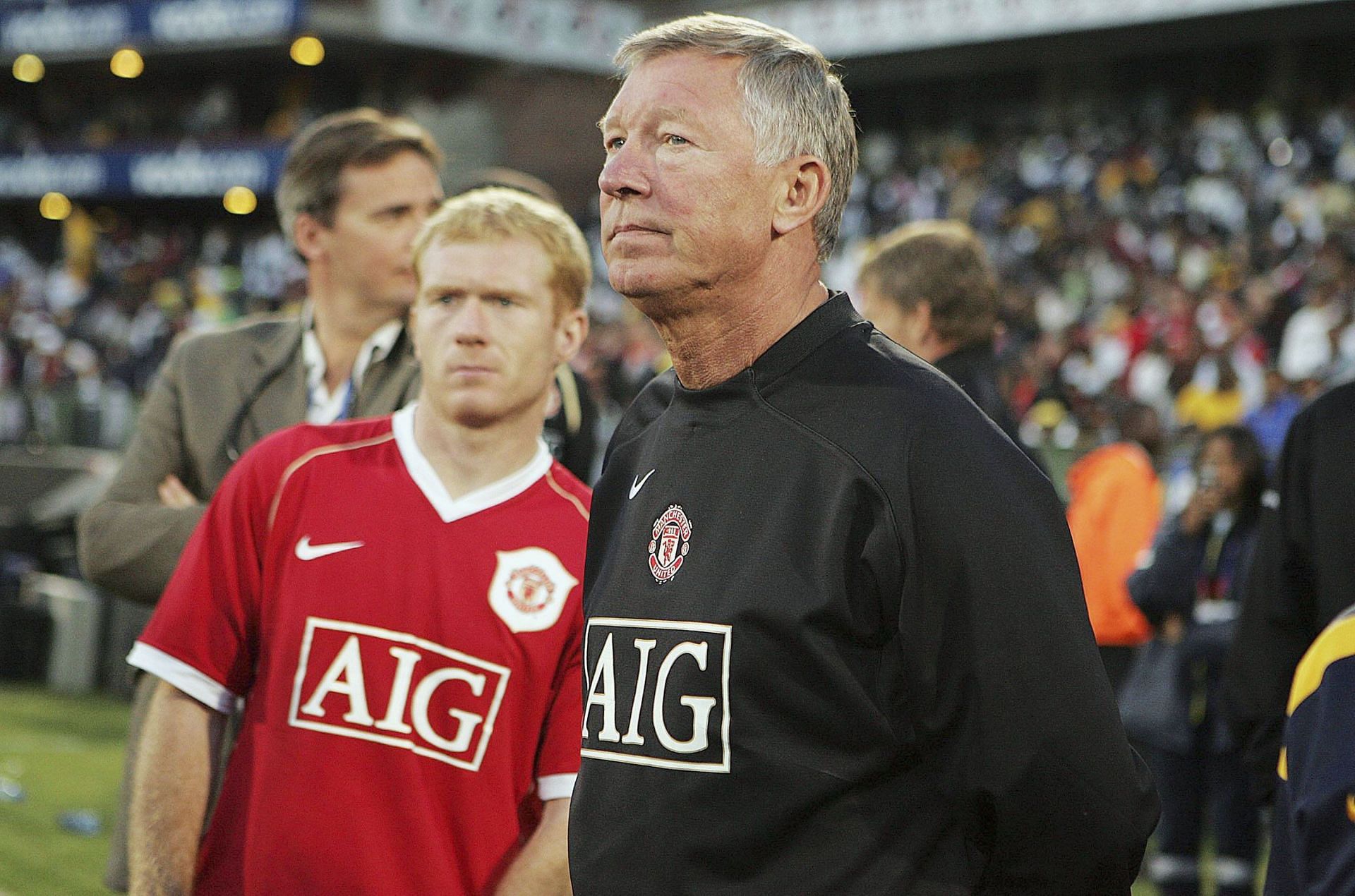 Paul Scholes (left) is one of the best midfielders managed by Sir Alex Ferguson (right).