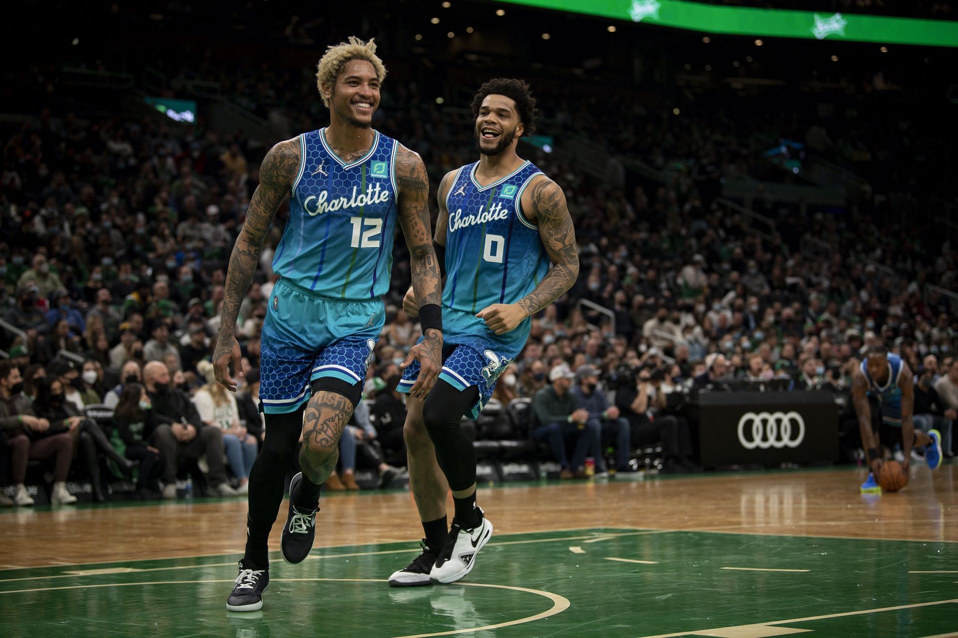 Miles Bridges celebrates a play with Kelly Oubre Jr.