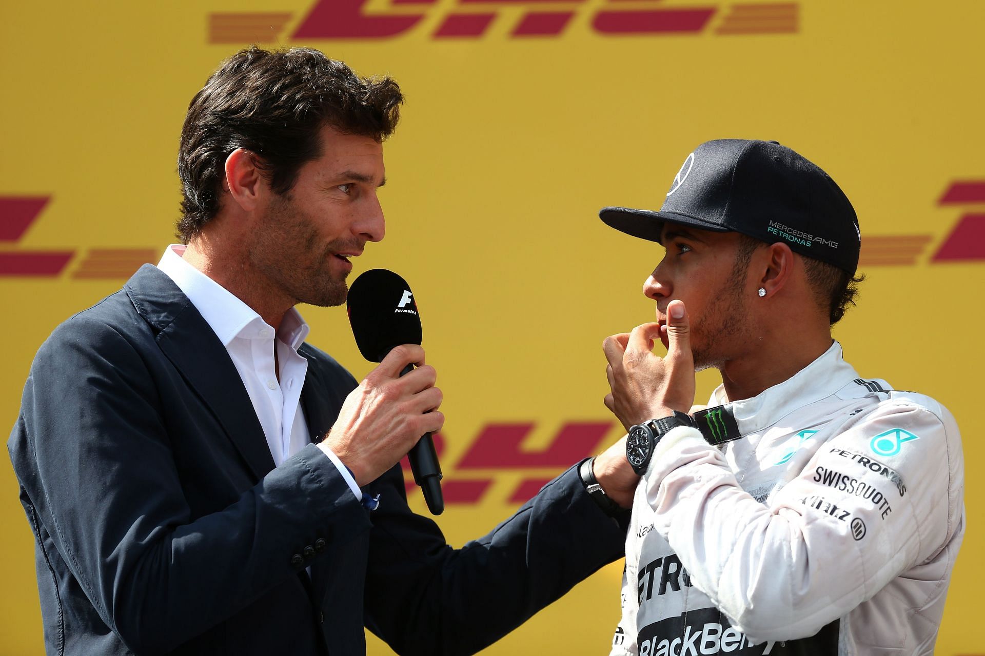 F1 Grand Prix of Austria - Mark Webber (left) interviews Lewis Hamilton on the podium