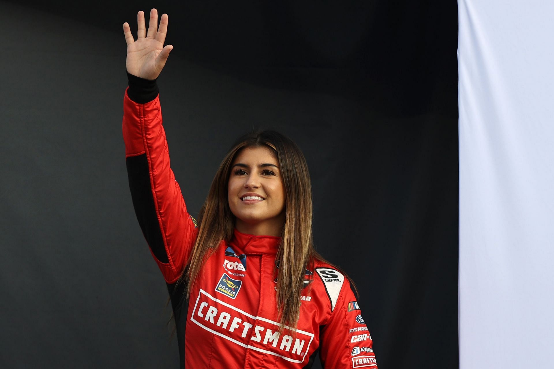 Hailie Deegan waves to fans before a race (Photo by Meg Oliphant/Getty Images)