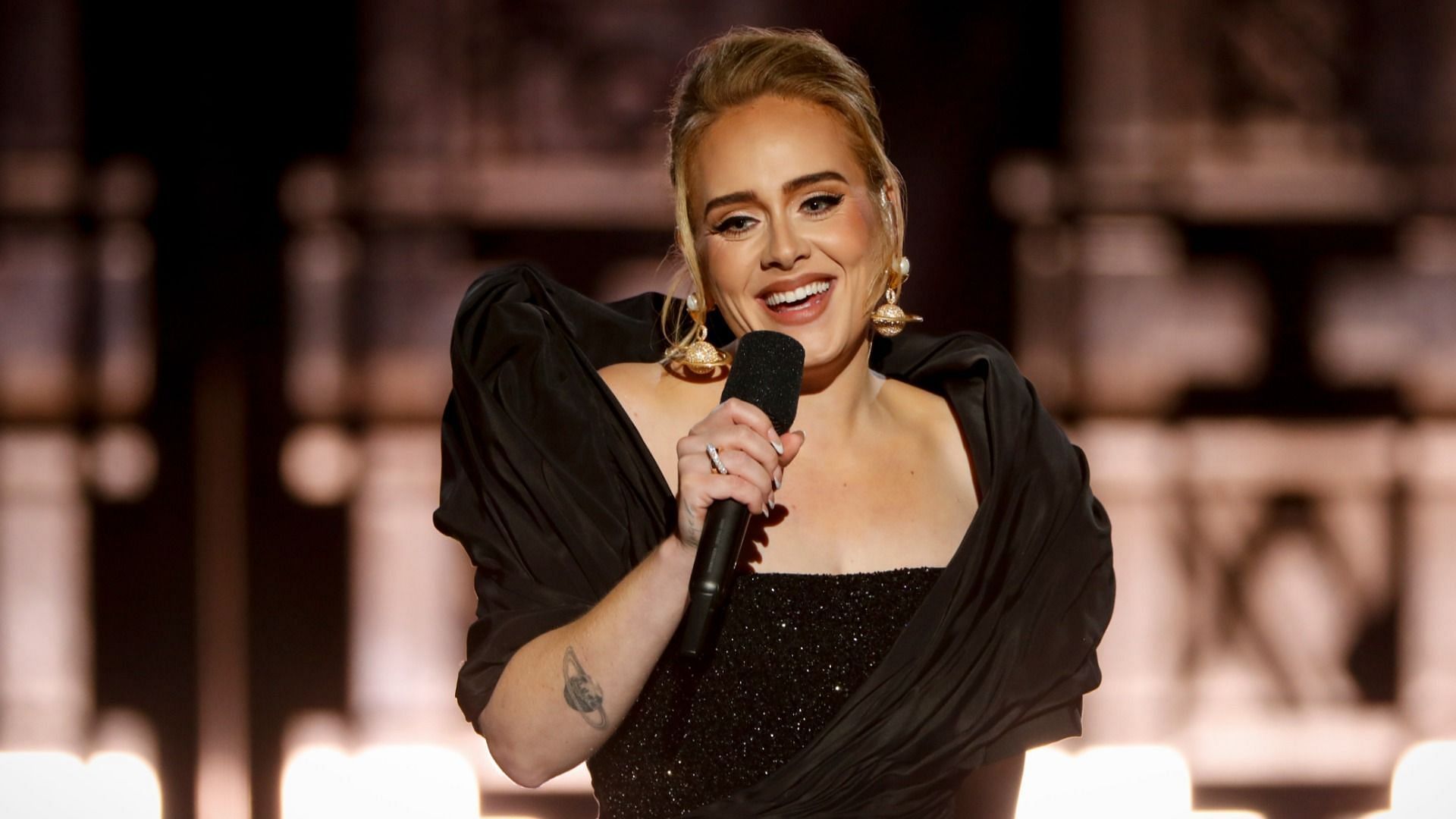 Adele surprised her fans in London after she stripped down and performed a pole dance amidst an ongoing contest (Image via Getty Images/ Cliff Lipson)