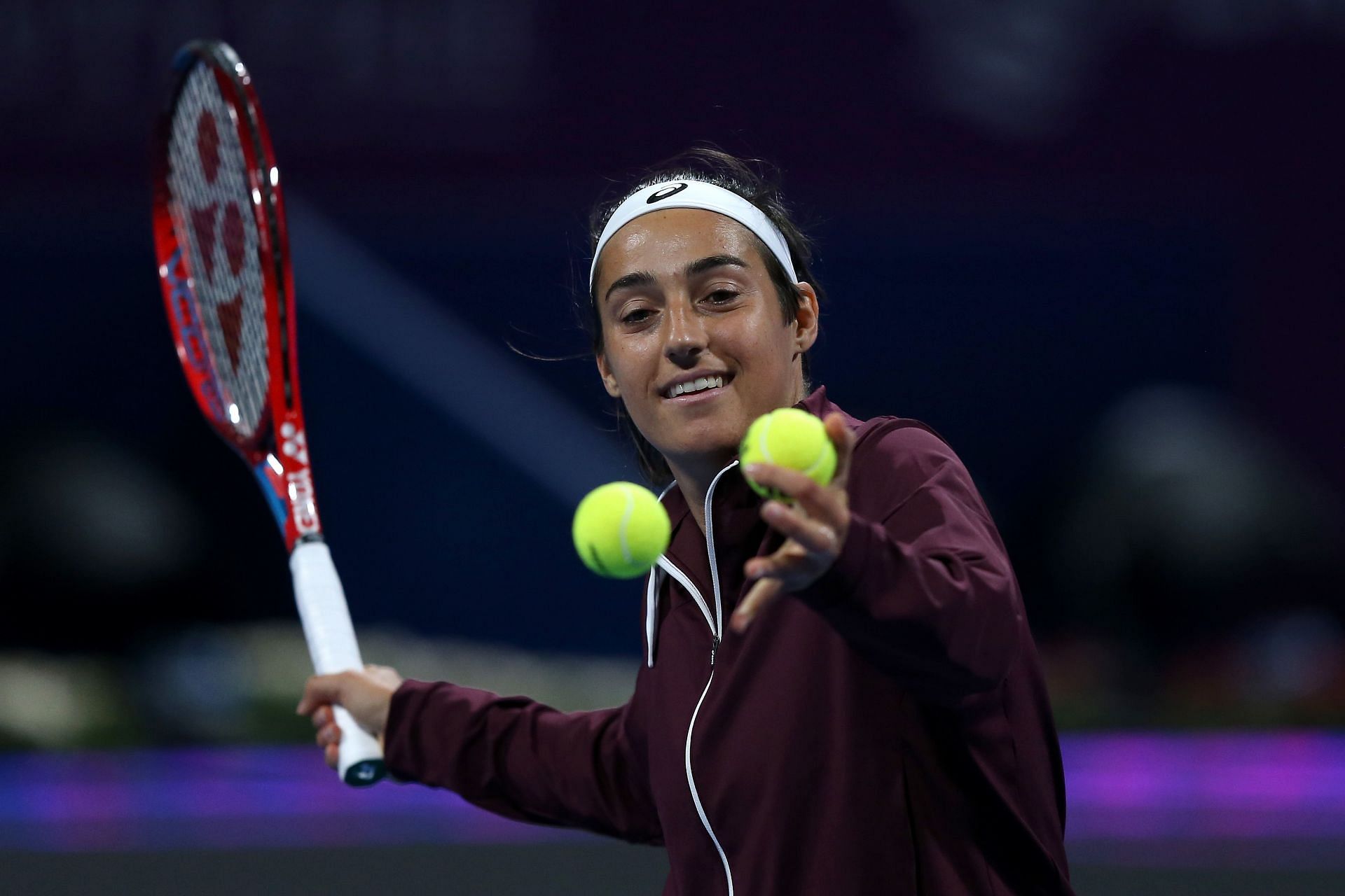Caroline Garcia celebrates her first-round win over Simona Halep in Doha on Monday.