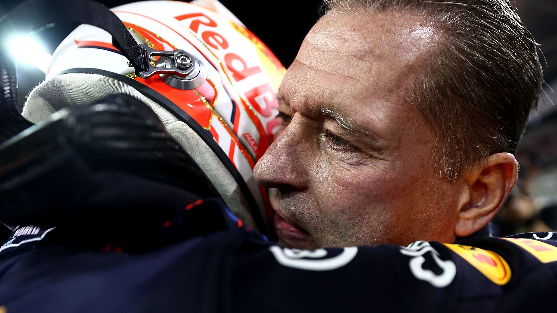 Max Verstappen (left) embraces his father Jos after winning his first F1 title at the 2021 Abu Dhabi Grand Prix