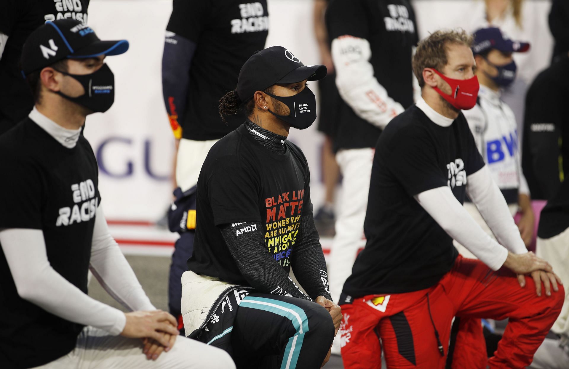 F1 Grand Prix of Bahrain - (L to R) Nicholas Latifi, Lewis Hamilton and Sebastian Vettel take the knee, signifying support to end racism in F1