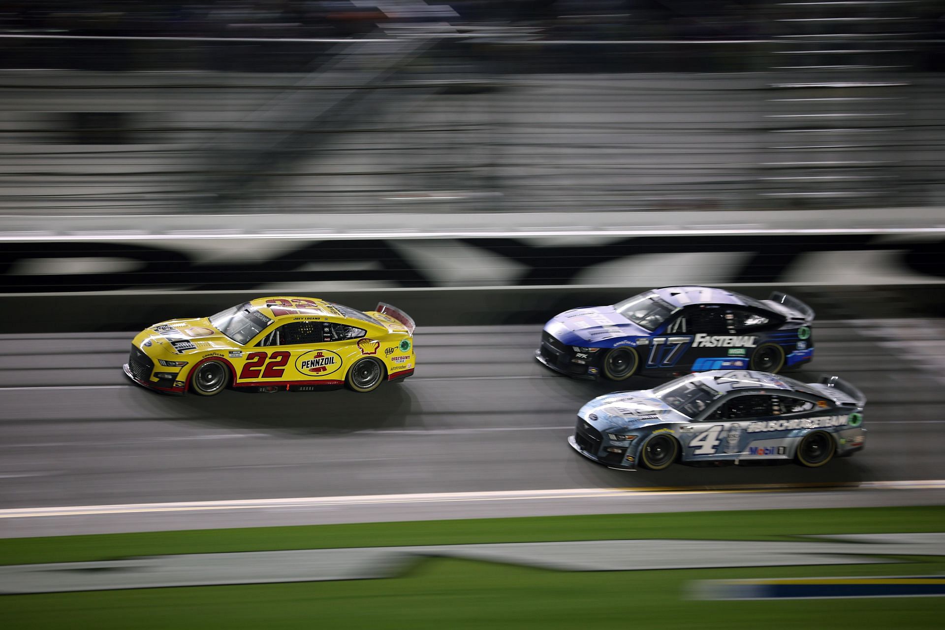 Joey Logano (#22) leads Chris Buescher (#17) and Kevin Harvick (#4) during the NASCAR Cup Series Bluegreen Vacations Duel #2 at Daytona (Photo by James Gilbert/Getty Images)