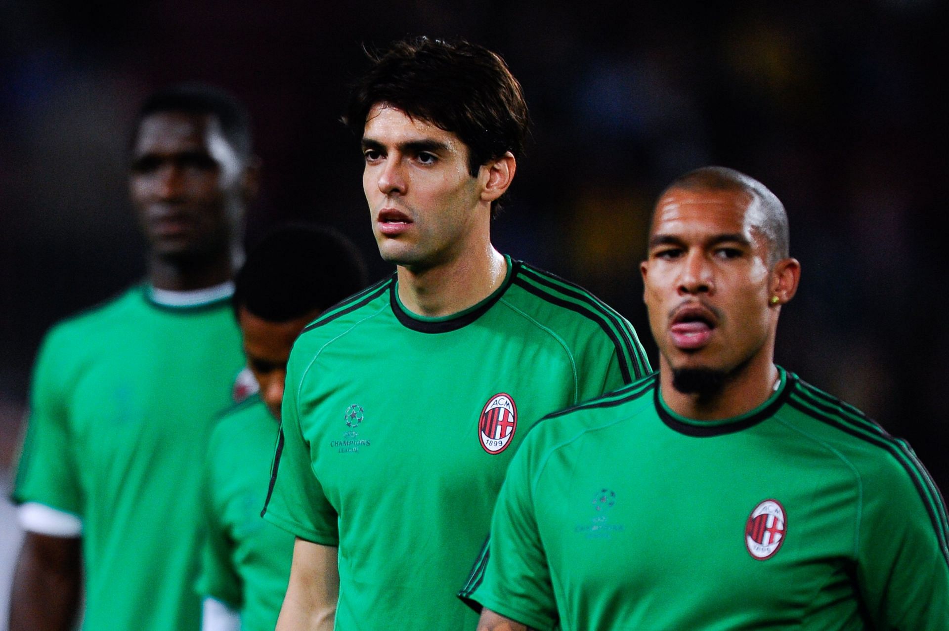 Kaka (left) flanked by Nigel de Jong ahead of a game against Barcelona.