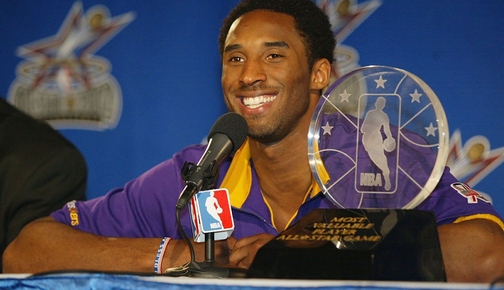 Kobe Bryant celebrates his All-Star Game MVP award in 2002.